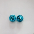Macro view of two glossy blue metal bells for DIY pet collars and holiday crafts - Blue