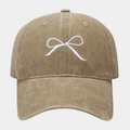 Close-up of white bow embroidery and washed cotton fabric on khaki baseball cap - Adjustable / Khaki