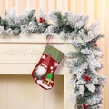 Detail of hanging large burlap Christmas stocking with gnome and Noel embroidery - Red