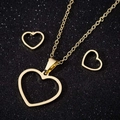 Golden heart jewelry set with necklace and earrings on a black sparkling background - Style 044 (Geometric Hollow Heart) / Gold