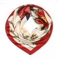 Close-up of elegant silk square scarf with red baroque chain print and gold motifs - 90x90cm / Red
