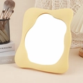 Creamy yellow cloud shaped vanity mirror with a soft matte wave frame on a desk - Irregular Square Makeup Mirror Yellow