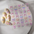 Detailed 5D embossed nail stickers featuring pink ribbons and bows on almond nails - Macaron 5D Relief Butterfly (CO-159)
