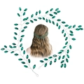 Silver bridal hair vine with green crystal leaves shown as a ring and on blonde hair - Green