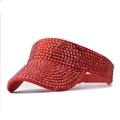 Close-up of sparkling red rhinestones on the surface of an adjustable sun visor cap - Dotted Diamond Red