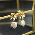 Vintage golden floral earrings with white baroque pearl pendants hanging on a glass box - Chrysanthemum Stud White Small-12mm