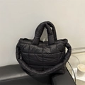 Black quilted puffer tote bag with large square stitching and puffy nylon material - Black