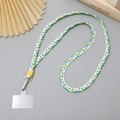 Gradient woven cotton phone strap with metal clasp and clear tab connector on gray background - White Yellow Green