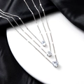 Minimalist layered silver necklaces with star, heart, and teardrop crystal pendants - Silver
