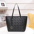 Chic black tote bag with quilted geometric patterns and golden ring tassel charms - Black