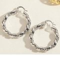 Macro detail of silver twisted rope hoop earrings with a polished metallic finish - Twisted Rope Earrings-Silver