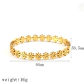Elegant gold daisy titanium steel bangle featuring sparkling floral center details - Gold Daisy Link Bangle (TB7192)