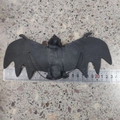 Realistic black rubber bat toy with red eyes and 24cm wingspan for Halloween decor - Regular Large 23*9.5CM