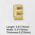 Macro view of gold-plated cubic zirconia letter E pendant with dimensions and size info - Letter E
