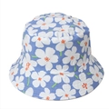 Close-up of cotton sun hat featuring white floral prints on a blue reversible fabric - M (56-58cm) / Blue