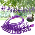 Portable purple retractable clothesline with 12 clips and hooks for outdoor travel use - Purple