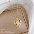 Macro shot of gold heart pendant with crystal inlay and detailed chain measurements - Gold Hollow Heart (H539)