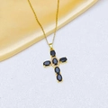 Detail of a gold cross necklace featuring oval black stones and sparkling zircon pavé - Gold Black Necklace