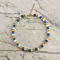Detail of glacier blue cat eye beads necklace with gold heart pendant and lobster clasp - Orange Blue Tri-color Stitching Necklace 38+5cm