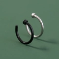 Macro shot of minimalist black and silver U-shaped stainless steel nose rings on green background - Simple Open Hoop / Black and Silver Set