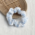 Chic scrunchie hair tie with blue floral print on white fabric on rattan tray - White with Blue Floral