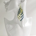 Layered gold and navy glitter teardrop earrings on model for a trendy rock style - NRXY-1378-3 Gold Blue Glitter
