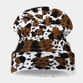 Close-up of the thick brown and black animal print knit texture on the warm winter beanie - 1# Brown White Black Cow Print