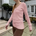 Pink V-neck cable knit sweater for women in a stylish outdoor garden setting - S / Pink