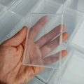 Clear plastic storage box for jewelry accessories with snap closure in hand view - Transparent Storage Box (9.5x6.5x1.3cm)
