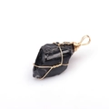 Detail of raw black tourmaline crystal pendant with handcrafted golden wire wrap - Obsidian