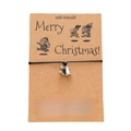 Christmas wish bracelet featuring black woven ropes with silver bell charms on a card - Bell