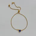 Adjustable gold heart bracelet with vibrant blue cubic zirconia and box chain - Blue Zircon Heart (B676) / Gold