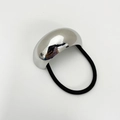 Detailed close-up of a black elastic hair tie featuring a polished silver metallic accent - Eco-friendly Style A Silver