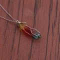 Macro shot of rainbow hexagonal crystal pendant wrapped in silver wire on leather - A-NSN0235 Platinum Copper O-Chain