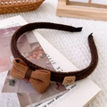 Close-up of brown knitted headband with corduroy bow and cute rabbit patch detail - Dark Coffee Style