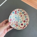 Detailed top view of handmade coconut shell bowl with inlaid blue and pink shell mosaics - Polka Dot Blue Flower