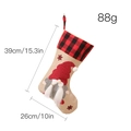 Nordic Christmas gnome stocking featuring red polka dot hat and buffalo plaid cuff - Polka Dot Braid Female Style