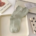 Pistachio green cotton ribbed mid-calf socks with minimalist white woven tag detail - One Size / Milky Green
