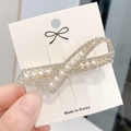 Elegant gold bow hair clip with sparkling crystals and white pearls on display card - Gold Pearl Rhinestone Bowknot (ak4002)
