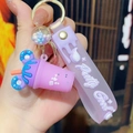 Detail of purple ice cream tea cup keychain with Pretty Good silicone wrist strap - Purple (Individual Packaging)