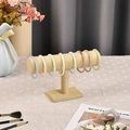 Linen T-bar jewelry display stand with colorful bracelets in a cozy home setting - Hemp Fabric / Single Layer / Natural Linen