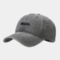 Close-up of HELLO embroidery and vintage washed texture on dark gray cotton baseball cap - Adjustable / Gray