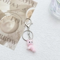 Close-up of a pink flocked cat keychain with metal ring and clasp on a white background - Lying Style Pink Cat