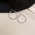 Macro view of geometric silver hoop earrings in a minimalist C-shape design - Small Silver Hoop (39#)