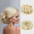 Detail view of light blonde curly hair bun extension with secure inner comb attachment - 613# (Bleach Blonde)