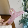 Detailed view of a pink translucent butterfly hair claw clip with golden metal spring - Jelly Pink