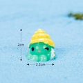 Miniature green sea creature figurine with yellow shell hat, size 2cm by 2.2cm - No. 12 Green Octopus with Shell Hat