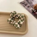 Green and white checkered organza scrunchie displayed on a wavy decorative tray - Green Plaid