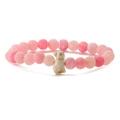 Detailed view of pink beaded stretch bracelet with natural stone and a cute penguin charm - Pink Weathered Stone
