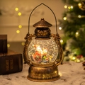 Vintage bronze Christmas lantern with spinning snow, Santa figure, and warm LED lighting - Santa Claus and Snowman